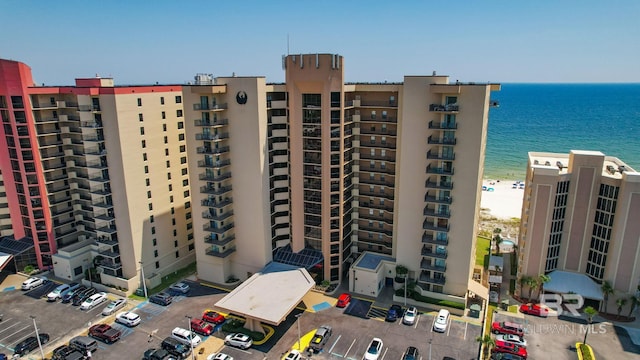 24132 Perdido Beach Blvd Unit 1081, Orange Beach, AL 36561 - view of apartment building / complex with view of water and beach and uncovered parking