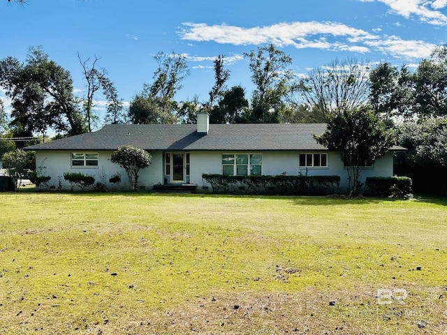 ranch-style home featuring a front yard