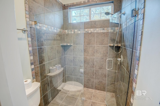 bathroom featuring toilet and an enclosed shower