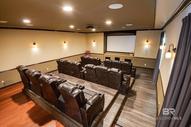 home theater with hardwood / wood-style floors and ornamental molding