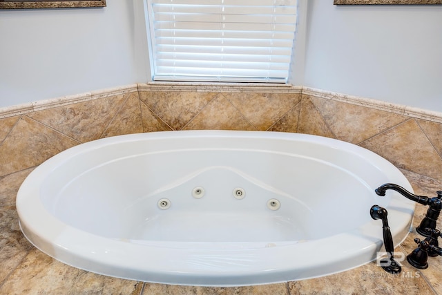 bathroom with tiled bath