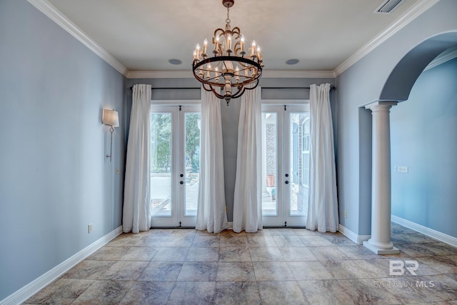 interior space featuring a chandelier, plenty of natural light, decorative columns, and french doors