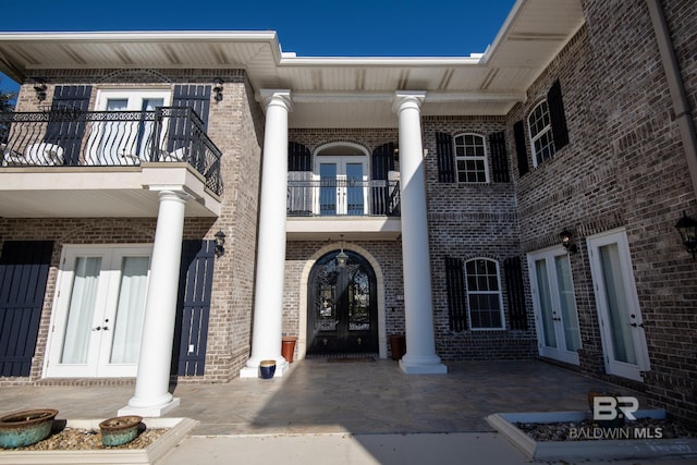 doorway to property featuring french doors and a balcony