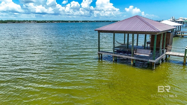 2764 W Beach Blvd, Gulf Shores, AL 36542 - dock featuring boat lift and a water view