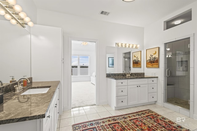 2764 W Beach Blvd, Gulf Shores, AL 36542 - full bath with tile patterned floors, two vanities, and a shower stall