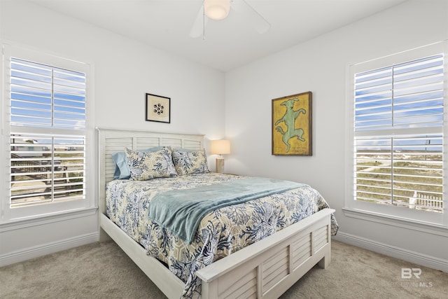 2764 W Beach Blvd, Gulf Shores, AL 36542 - carpeted bedroom featuring baseboards and a ceiling fan
