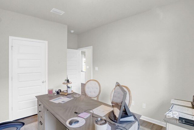 office space with hardwood / wood-style flooring