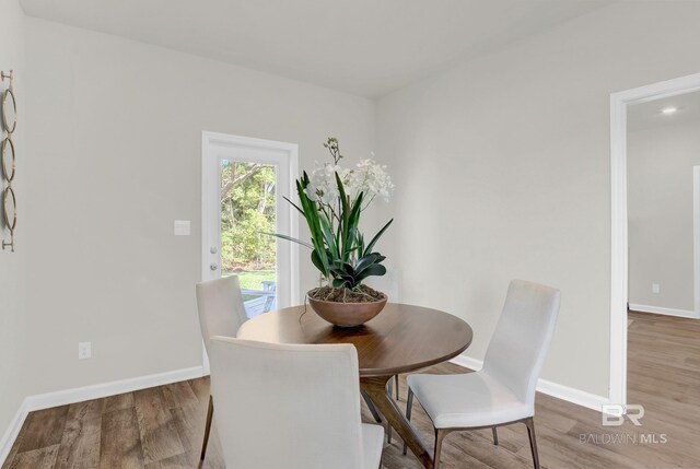 dining room with hardwood / wood-style floors