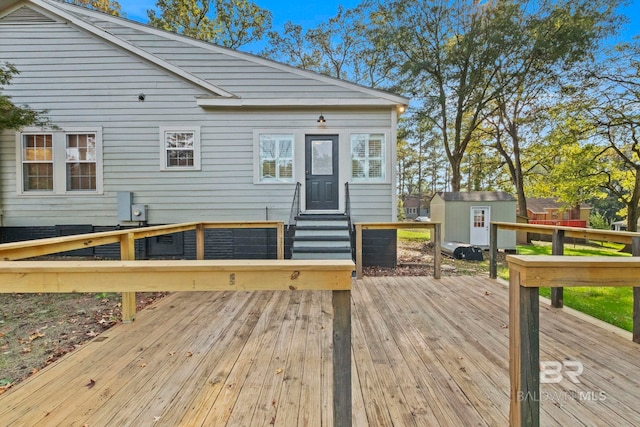 wooden terrace featuring a shed