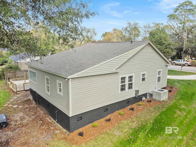 rear view of property featuring central AC unit