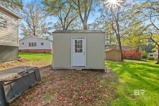 view of outdoor structure featuring a yard