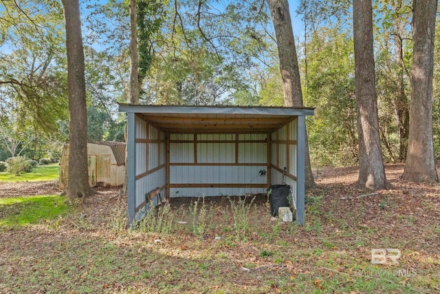 view of outbuilding with a carport