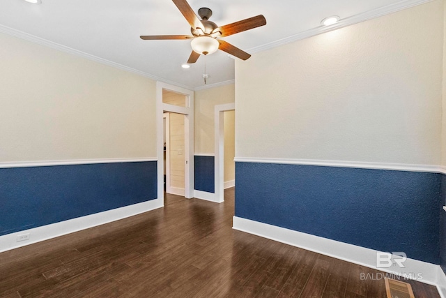 unfurnished room with crown molding, dark hardwood / wood-style flooring, and ceiling fan