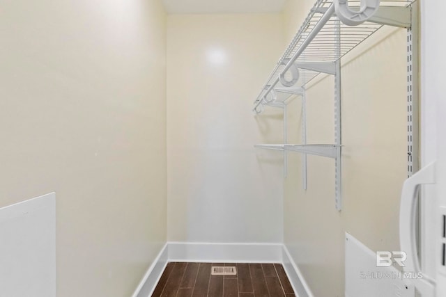 walk in closet featuring hardwood / wood-style flooring