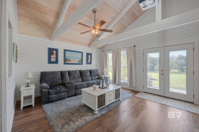 living room featuring wooden ceiling, dark wood-type flooring, french doors, wooden walls, and beamed ceiling