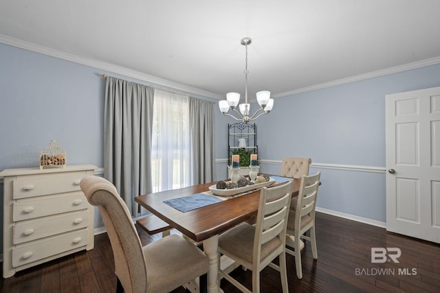 dining room with an inviting chandelier, dark wood-type flooring, and ornamental molding