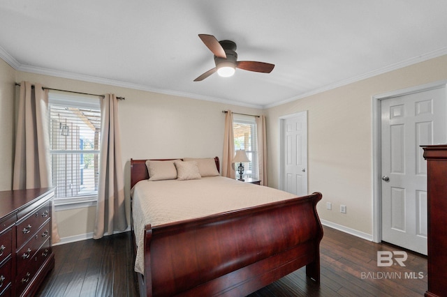 bedroom featuring dark wood-type flooring, ceiling fan, and ornamental molding