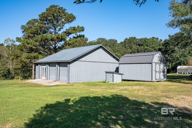 view of outbuilding with a lawn