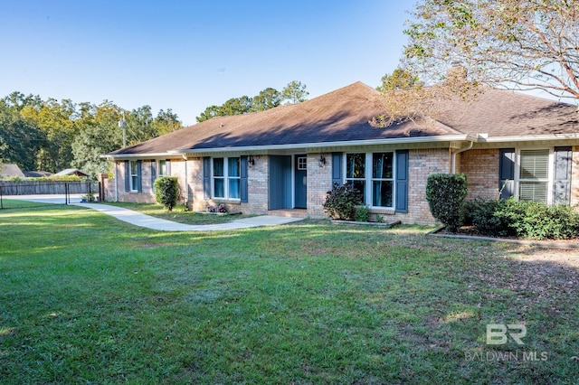 single story home with a front yard