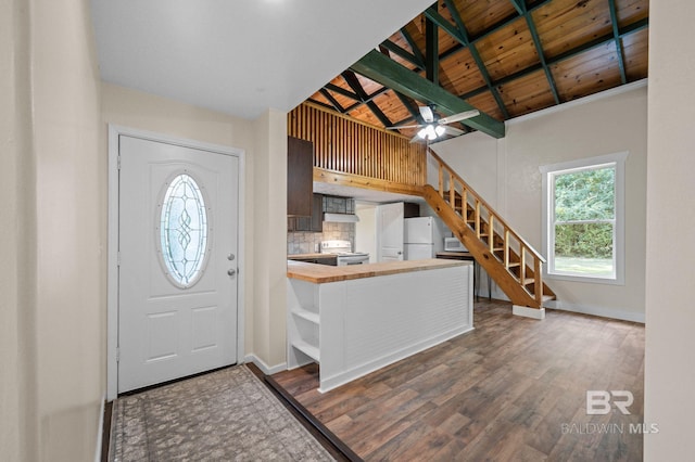 entrance foyer with lofted ceiling with beams, ceiling fan, wood ceiling, and hardwood / wood-style flooring