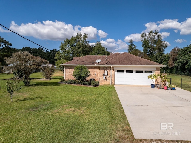 ranch-style house featuring a garage and a front yard