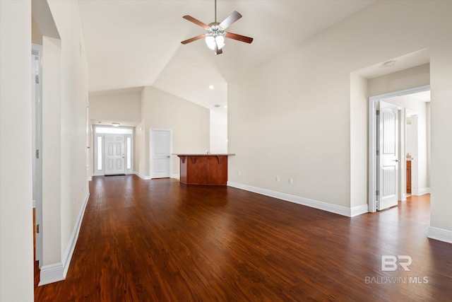 unfurnished living room with dark wood-type flooring, ceiling fan, and lofted ceiling