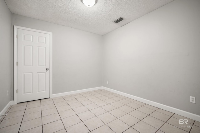 963 Shady Brook Dr, Mobile, AL 36606 - unfurnished room with a textured ceiling, baseboards, and light tile patterned floors