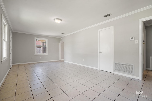 963 Shady Brook Dr, Mobile, AL 36606 - spare room with ornamental molding, light tile patterned floors, baseboards, and arched walkways
