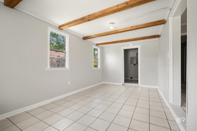 963 Shady Brook Dr, Mobile, AL 36606 - spare room with beam ceiling, baseboards, and light tile patterned flooring