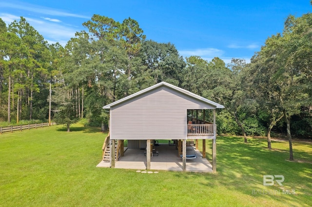 view of property's community with a patio, stairs, a carport, and a wooden deck