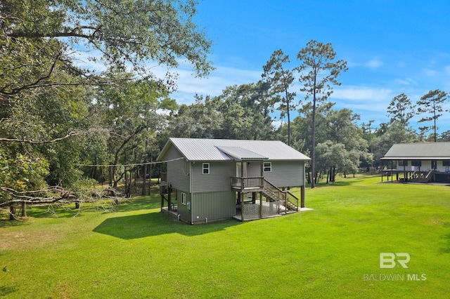 view of outdoor structure with stairway and view of scattered trees