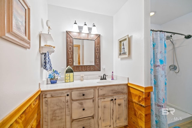 bathroom with vanity and a shower with shower curtain