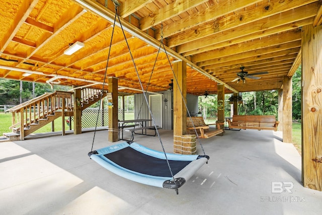 view of patio featuring stairs and ceiling fan