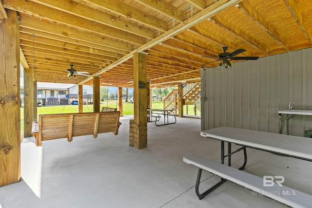 view of patio / terrace with stairs and a ceiling fan