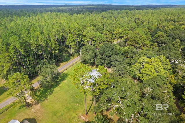 drone / aerial view of a heavily wooded area