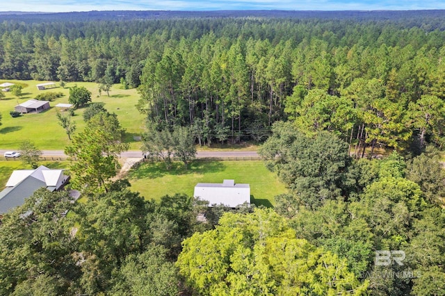 aerial overview of property's location with a forest