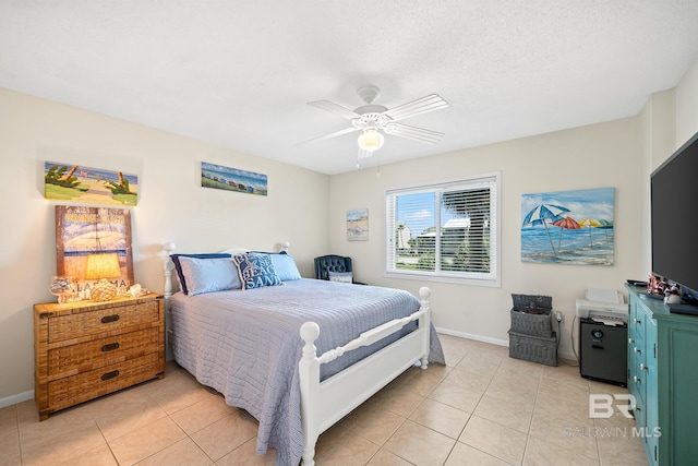 tiled bedroom featuring ceiling fan