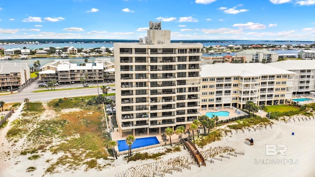 view of building exterior with a water view