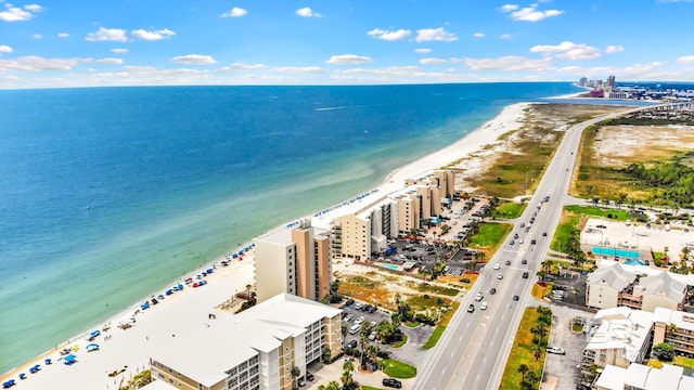 aerial view featuring a water view and a view of the beach