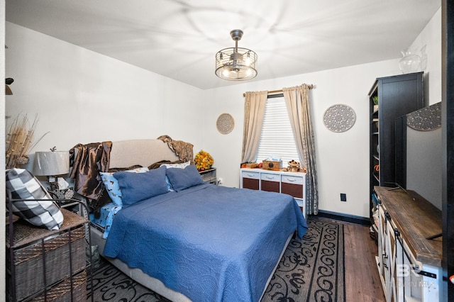 bedroom featuring dark wood-type flooring