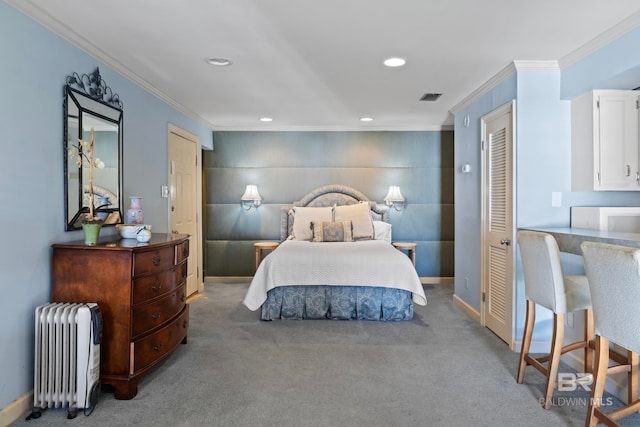 bedroom with radiator heating unit, light colored carpet, and ornamental molding