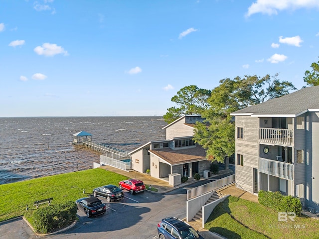 birds eye view of property with a water view