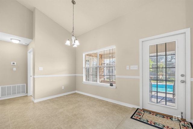 interior space with visible vents, baseboards, light tile patterned floors, an inviting chandelier, and high vaulted ceiling