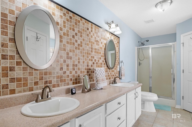 full bathroom with a sink, a shower stall, and tile patterned floors