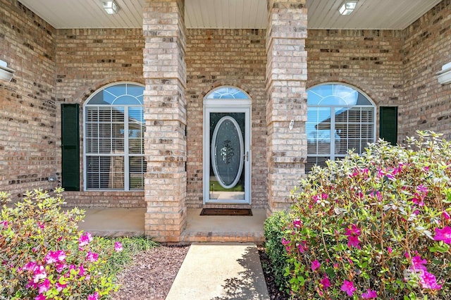 property entrance with brick siding