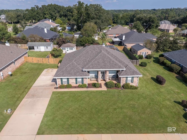 birds eye view of property with a residential view