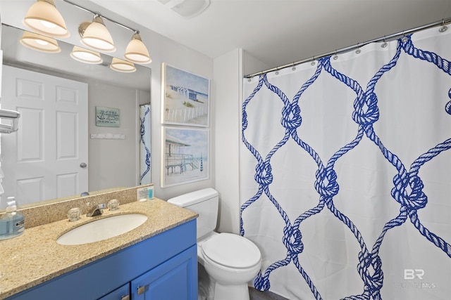 26115 Perdido Beach Blvd Unit 4-A, Orange Beach, AL 36561 - bathroom with toilet, vanity, and a shower with shower curtain