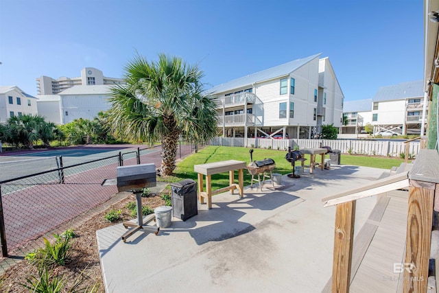 26115 Perdido Beach Blvd Unit 4-A, Orange Beach, AL 36561 - surrounding community with fence, a patio area, and outdoor dining area