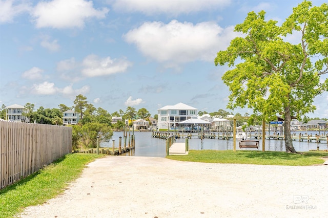 26115 Perdido Beach Blvd Unit 4-A, Orange Beach, AL 36561 - dock featuring a water view, fence, and a residential view