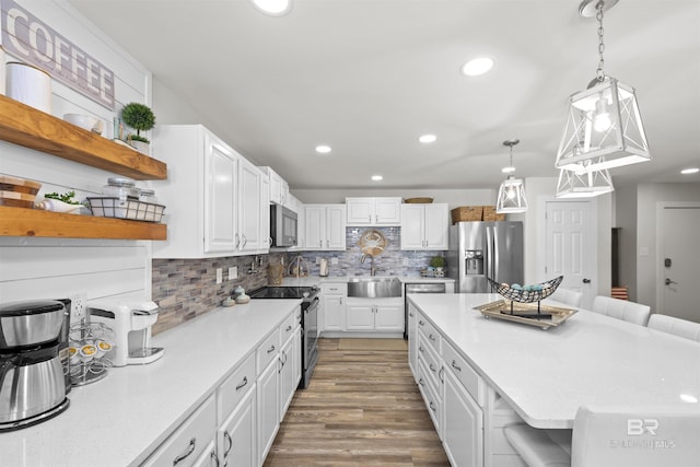 26115 Perdido Beach Blvd Unit 4-A, Orange Beach, AL 36561 - kitchen featuring stainless steel fridge, range with electric cooktop, a sink, open shelves, and white cabinetry